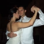 Couple in white dancing.