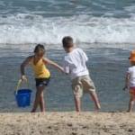 Kids playing on the beach.