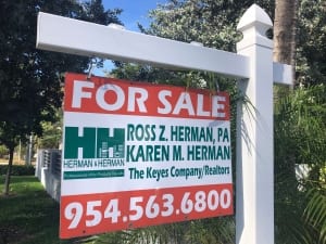 A South Florida real estate sign.