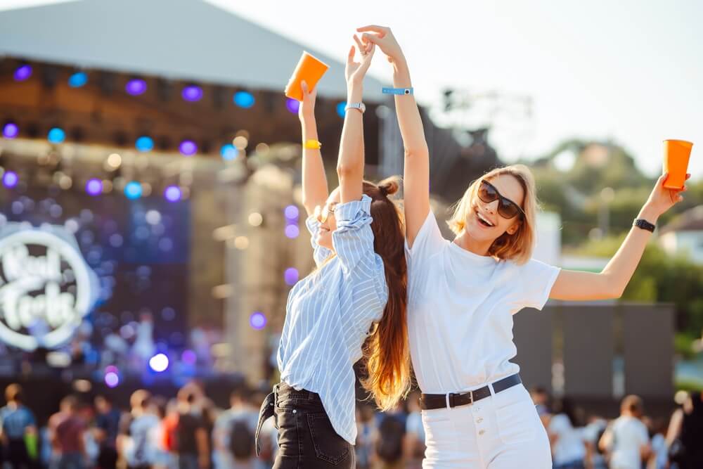 Two women dancing at a fall music festival in Pompano Beach